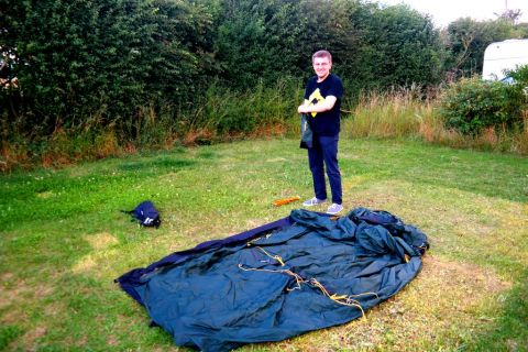 Cotswolds Camping site setting up tent