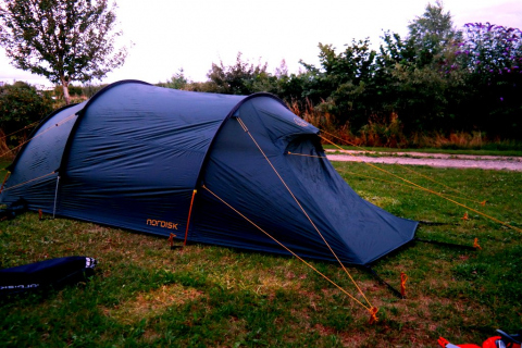 Cotswolds Camping site setting up tent
